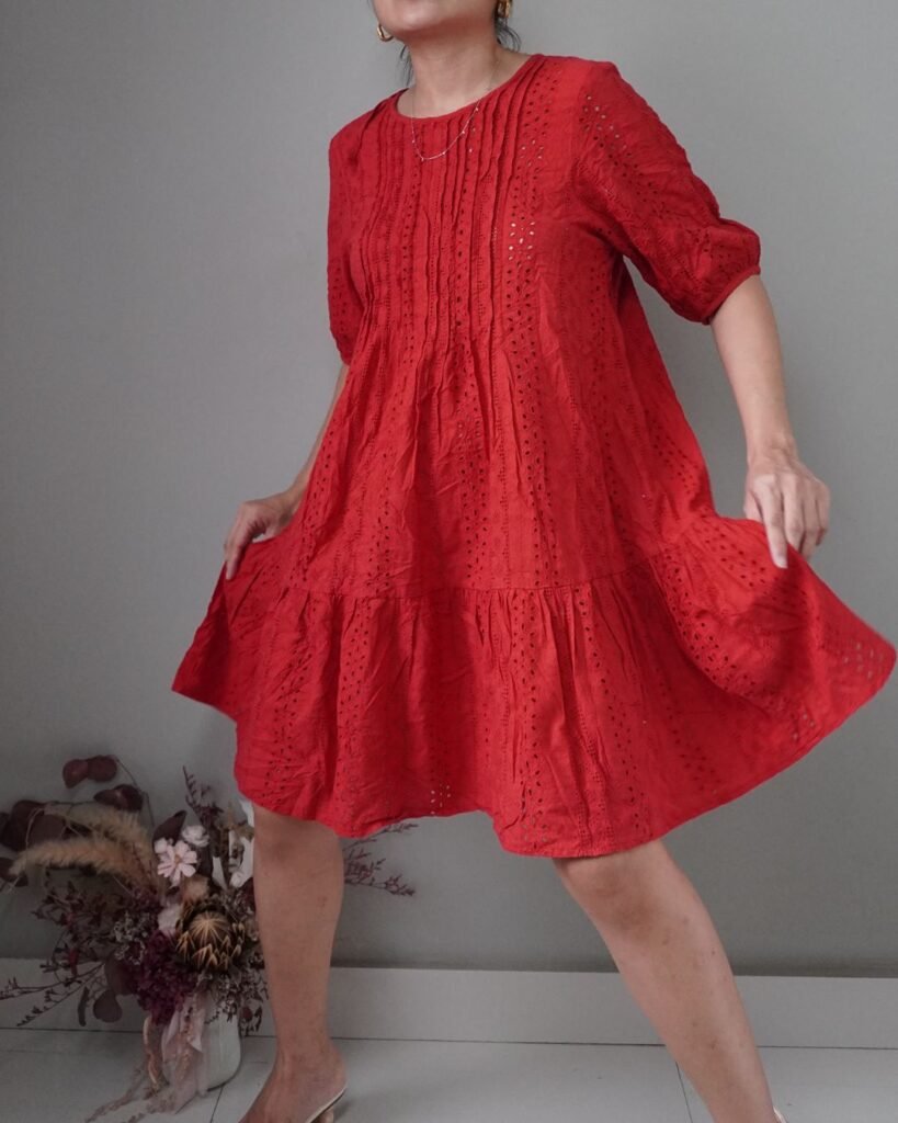 Something that’s really timeless— an eyelet piece, with a romantic red color, short and breathable