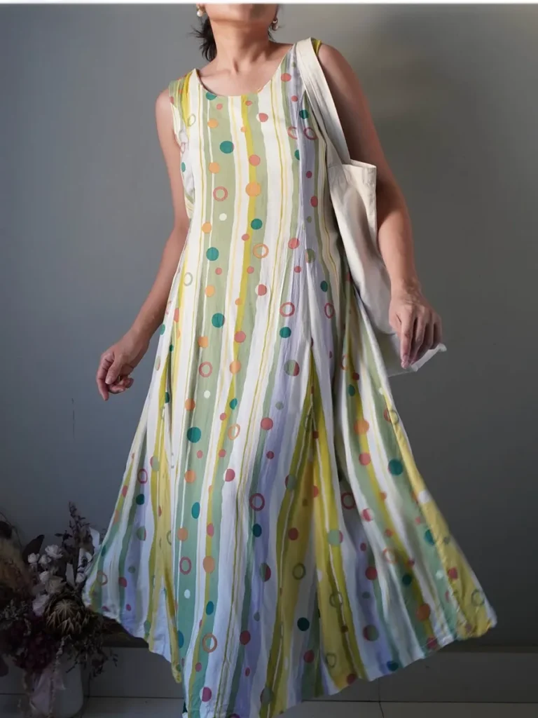 Retro multi colored flowy dress with a self tie ribbon at the back
