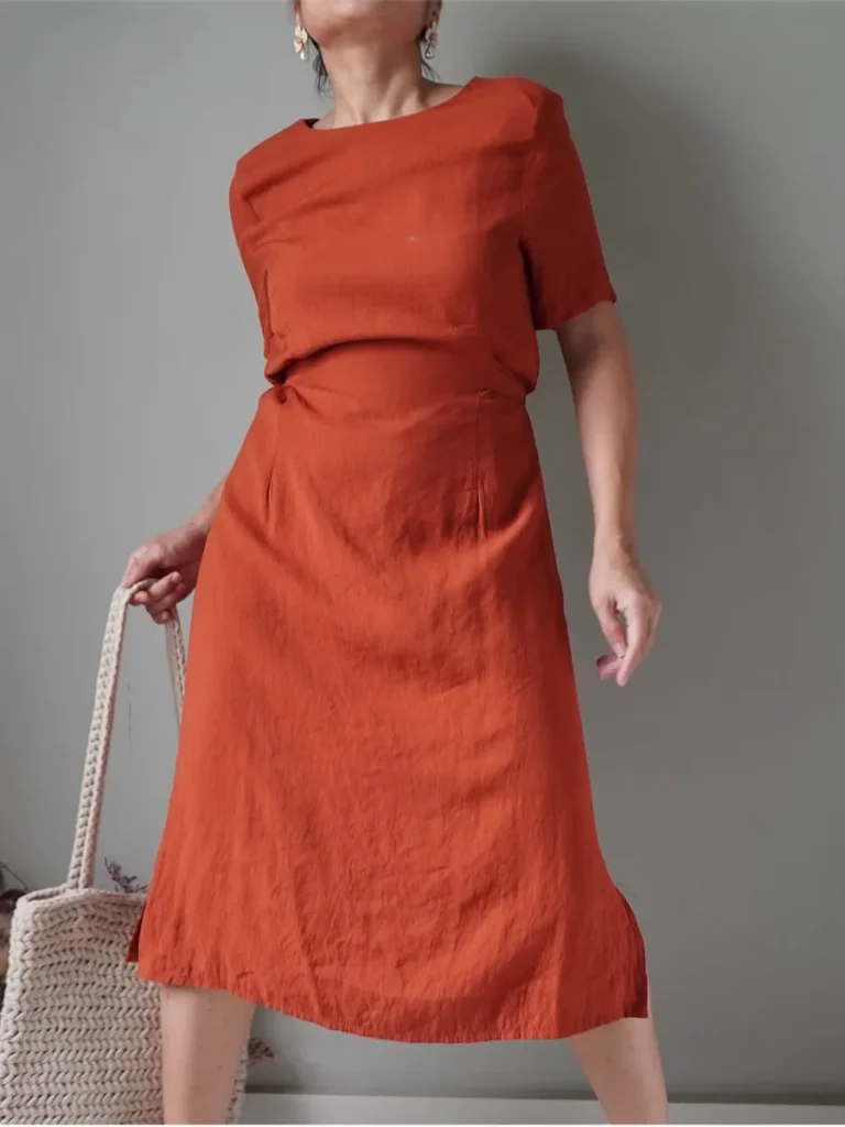 Classic burnt orange dress with a self the back ribbon