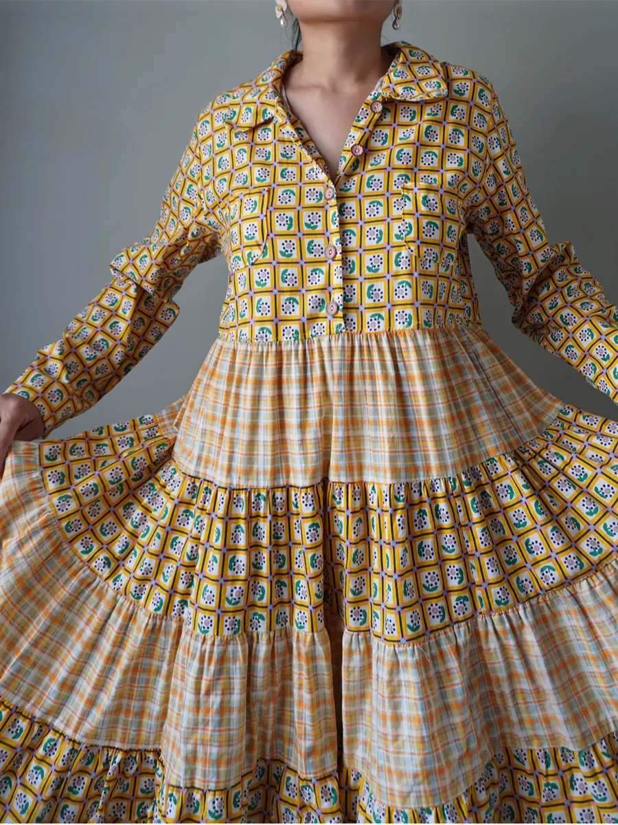 Playful patterned yellow tiered dress with long sleeves - Image 1