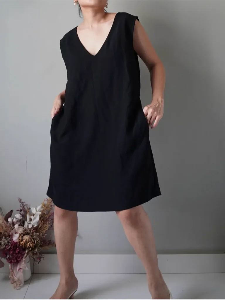Edgy black short sleeveless dress with pockets