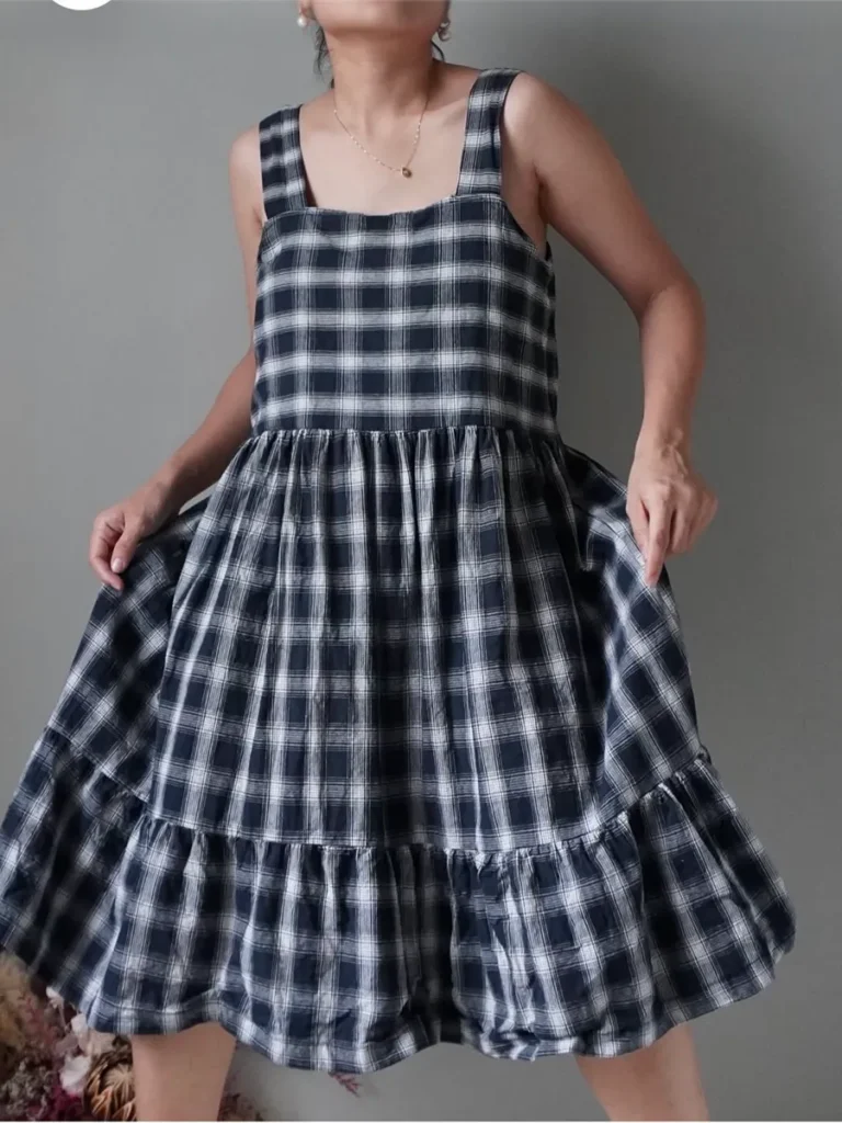 Charcoal plaid pattern slip-on dress with ruffle hem finish