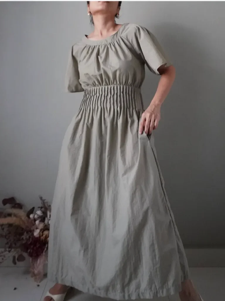 Loveliest sage dress with pleated accent at waist, timeless and chic