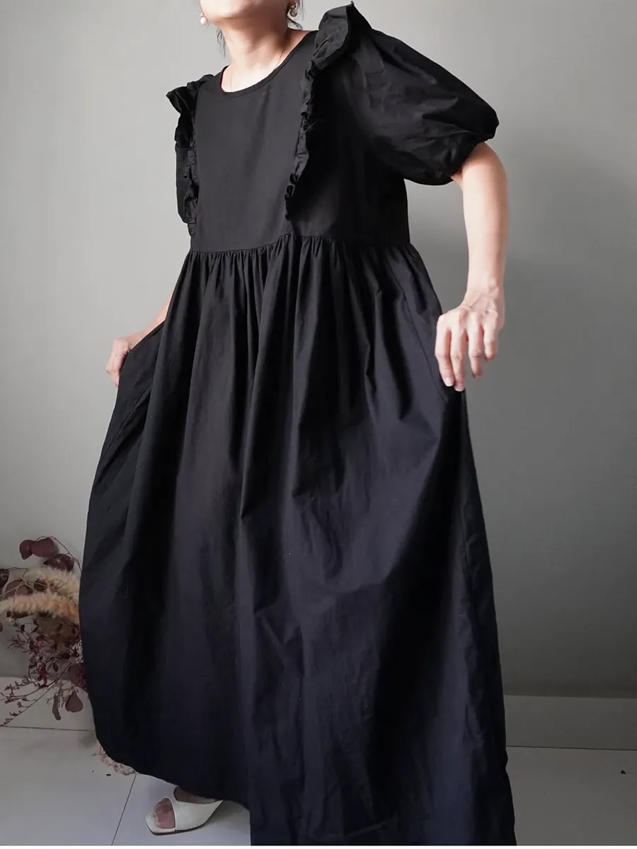 A little bit dreamy with this black babydoll dress - Image 1