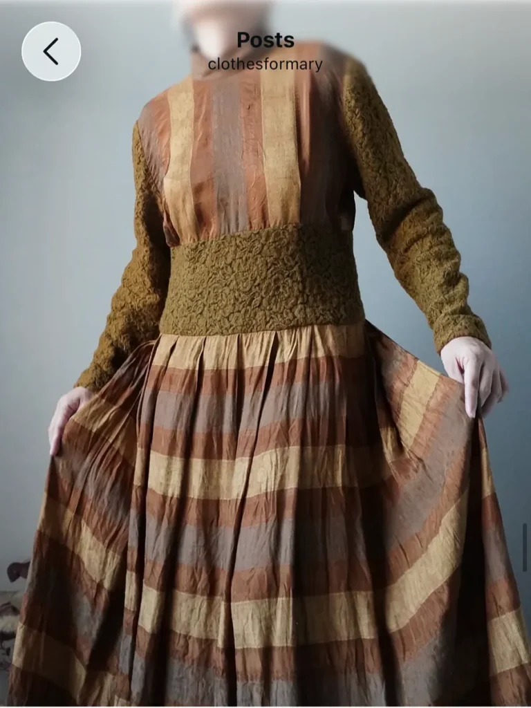 warm rust to brown hues, delicate long dress with lace fabric, full sleeves and plaid patterns, back buttons as well