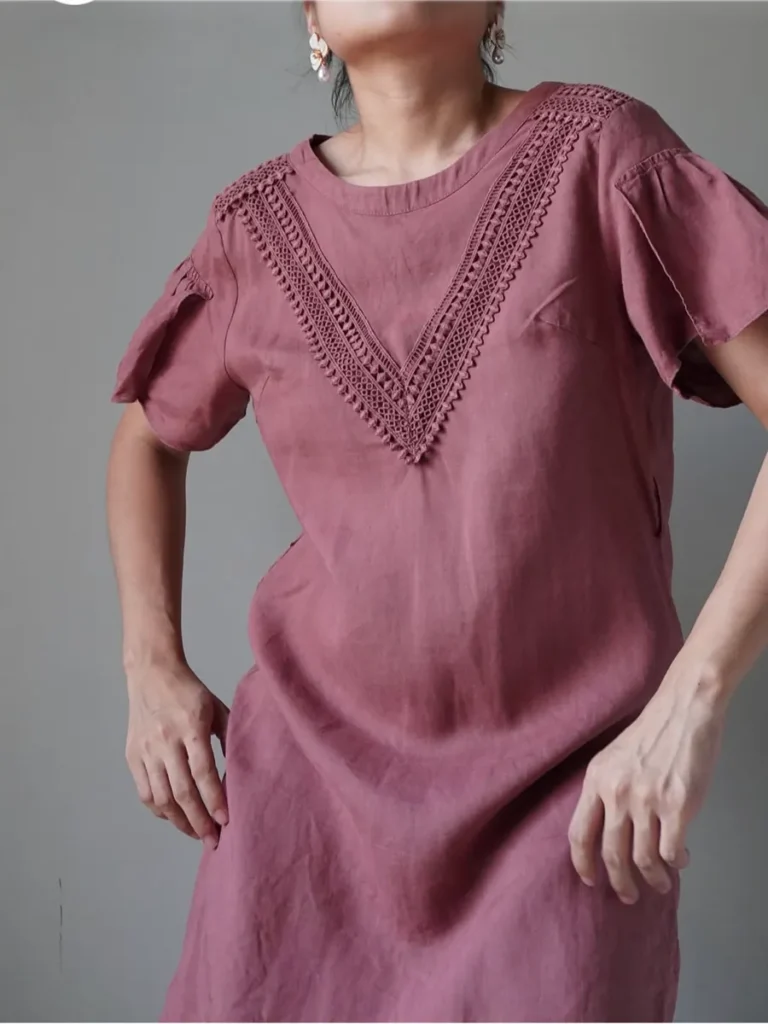 Simple rosewood linen blend dress with a triangular lace accent in front