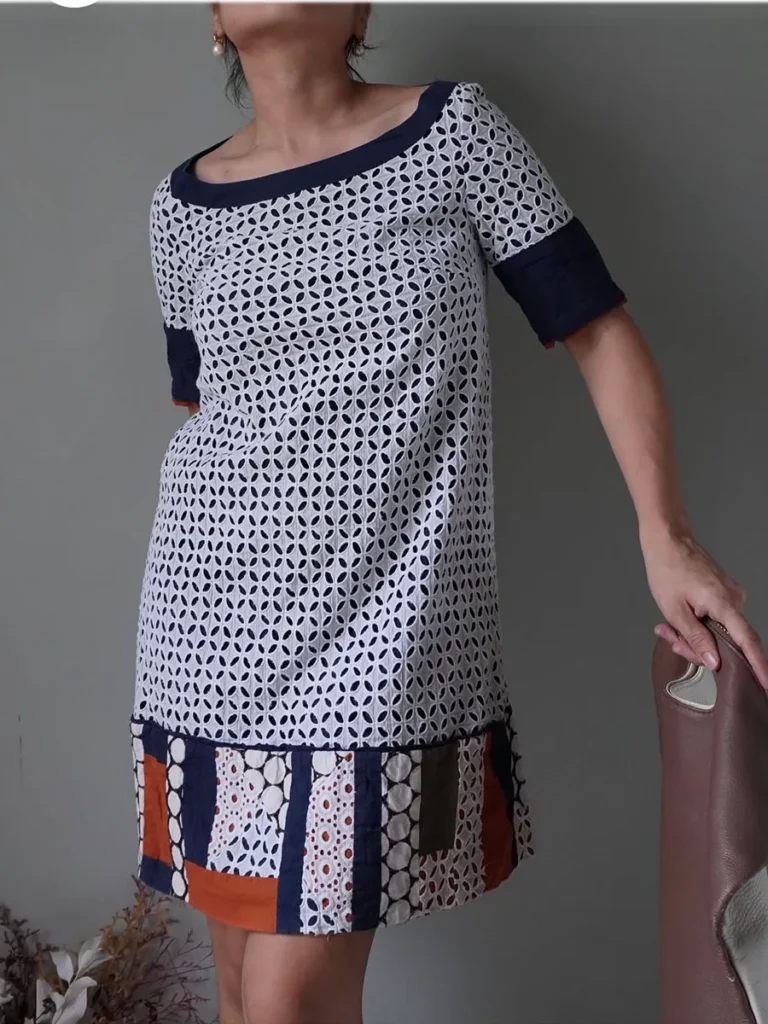 Lace overlay dress with abstract fabric cut-outs