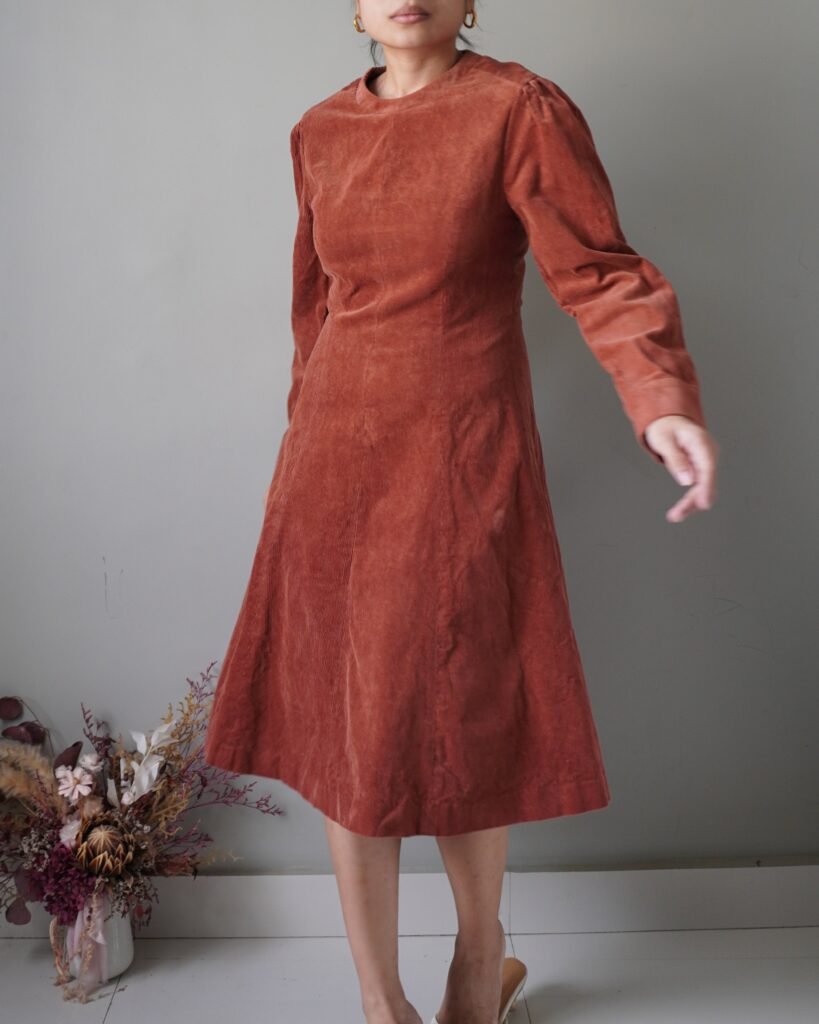 Something very timeless, rust cozy and modest corduroy dress with long sleeves and back zipper