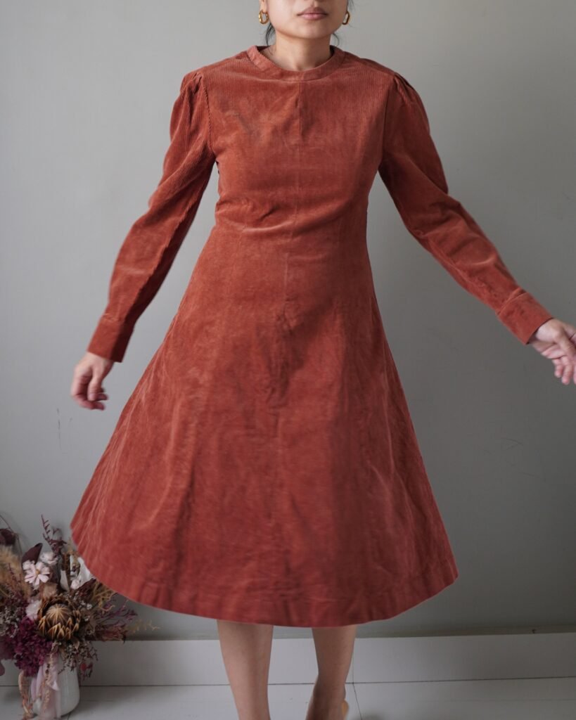 Something very timeless, rust cozy and modest corduroy dress with long sleeves and back zipper