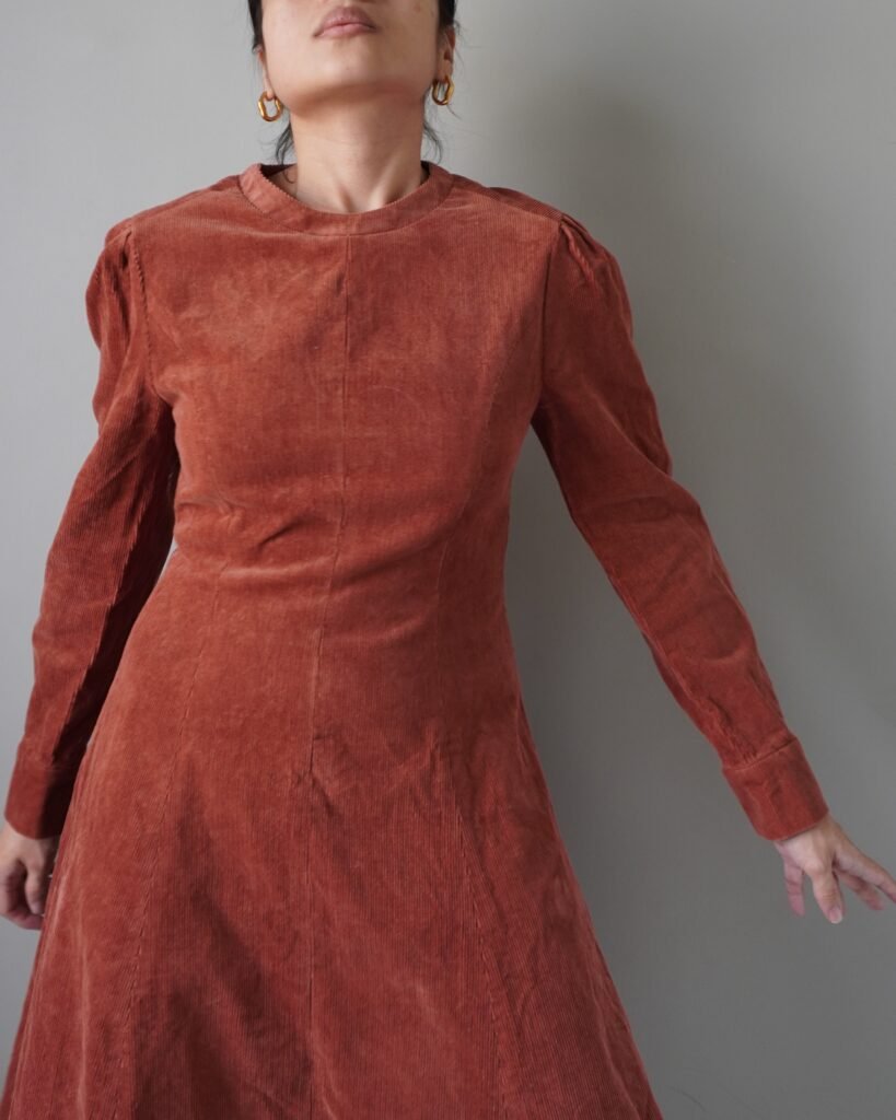 Something very timeless, rust cozy and modest corduroy dress with long sleeves and back zipper