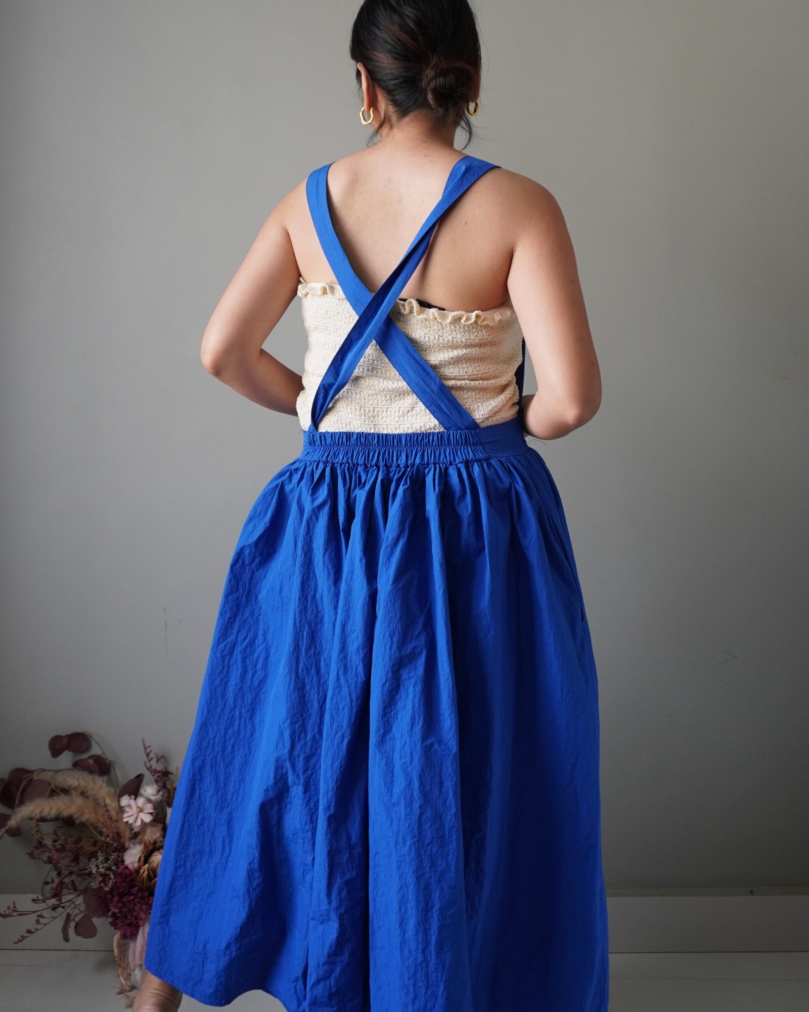 Solid crayola blue pinafore with pockets and crisscross back detail - Image 4