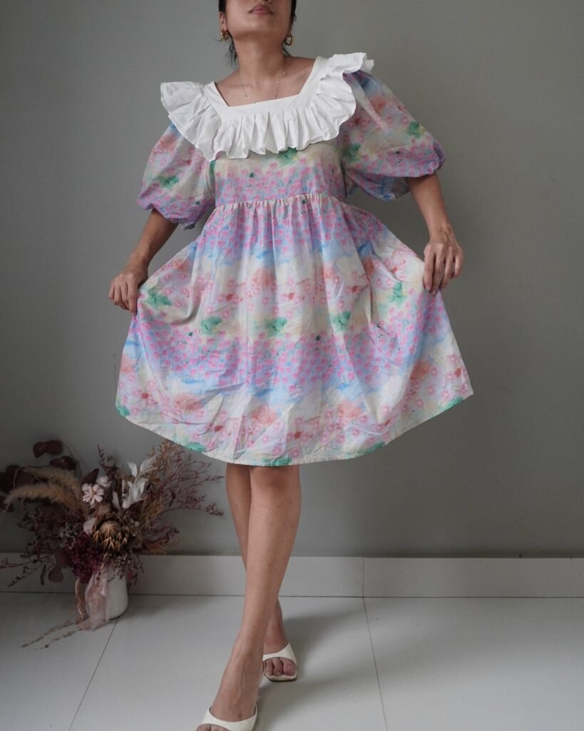 Artwork babydoll dress in pastel hues, has the loveliest collar and puffed sleeves