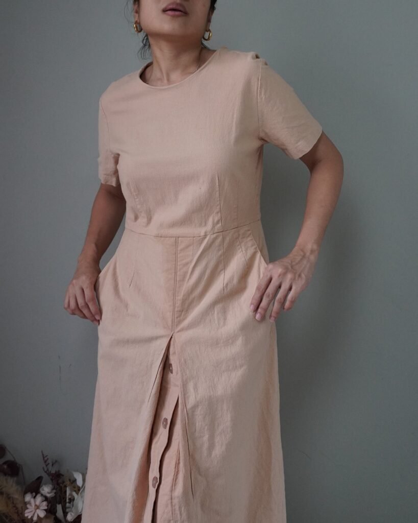 This is a beautiful botanical babydoll dress with collar and drawstring at waist