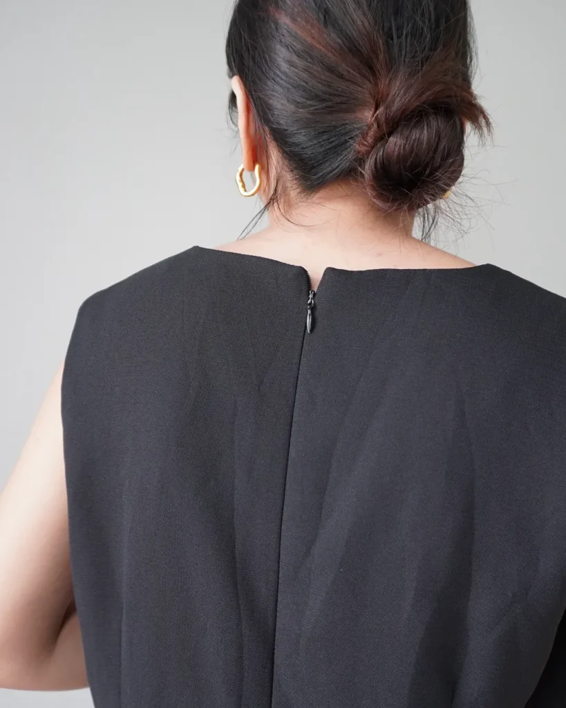 Quiet elegance. Black sleeveless dress with back zipper
