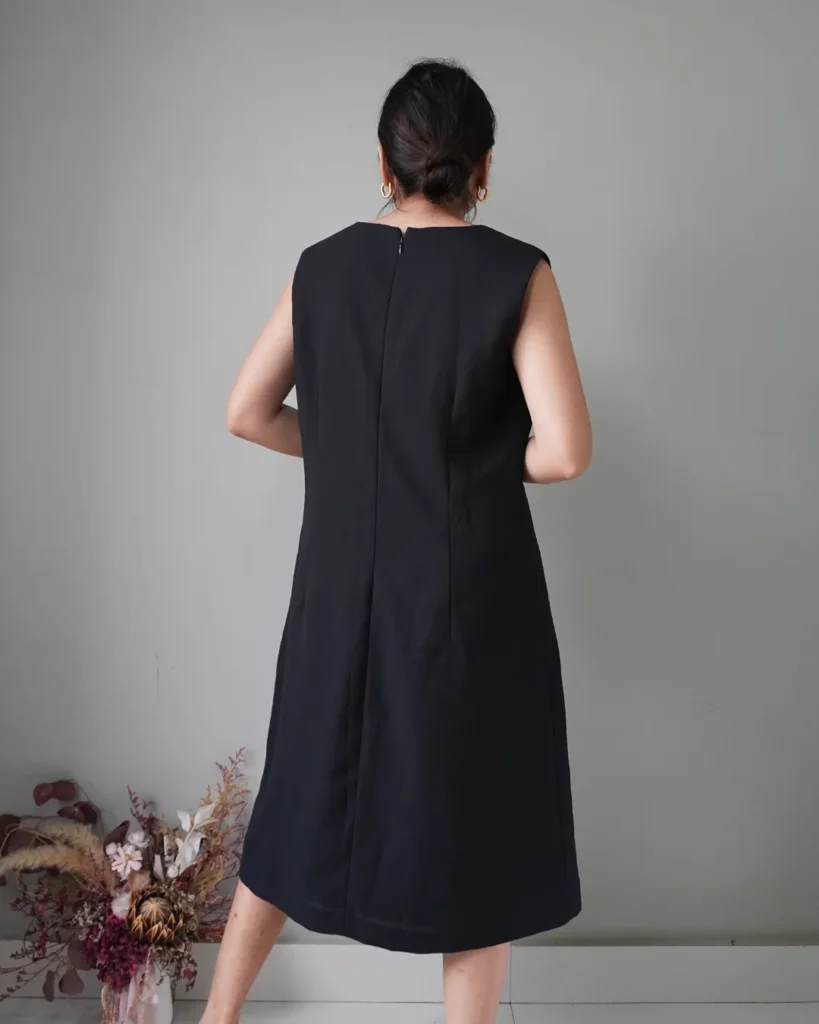 Quiet elegance. Black sleeveless dress with back zipper