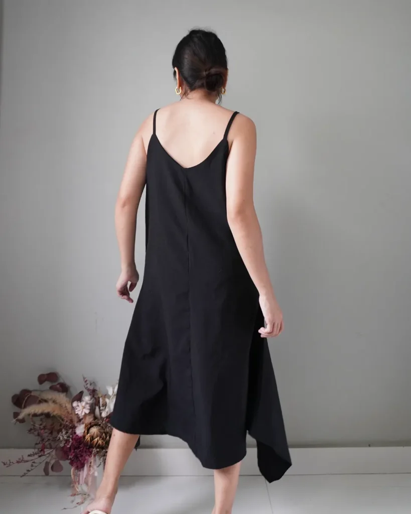 Asymmetrical black slip on dress