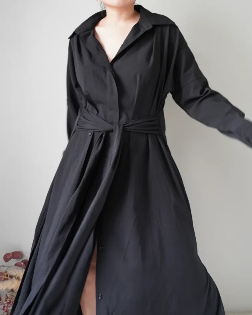 Timeless in every way, this is cozy black button down coat dress that you easily wear in cooler dinners out or save it for you next holiday!
