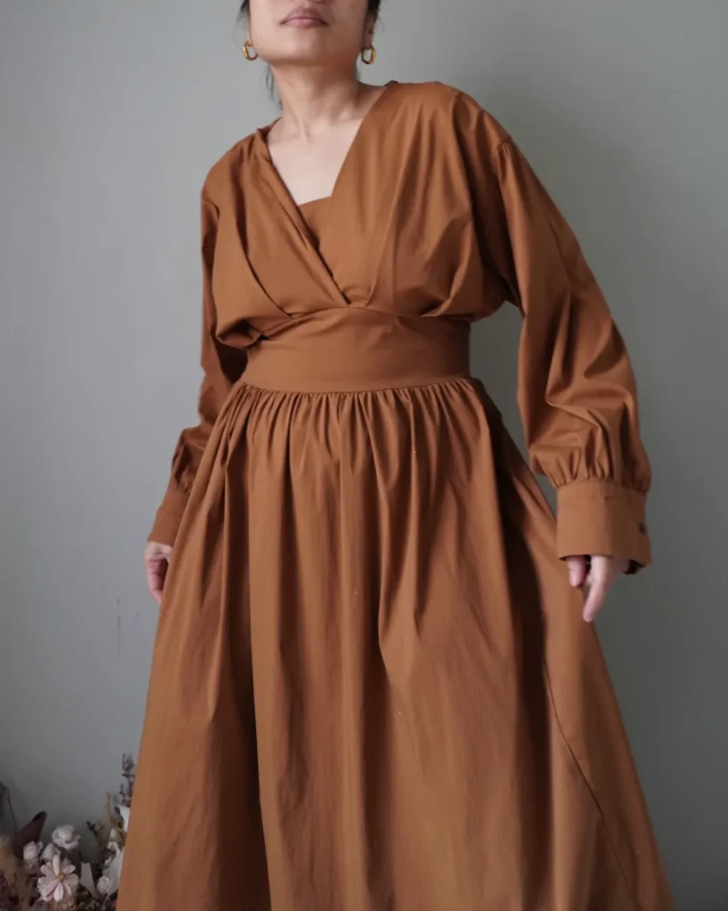 Burnt orange / copper beautiful fitted bodice dress with long sleeves, voluptuous waist down
