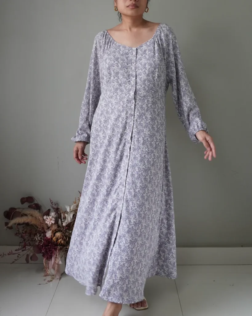 Ditsy romantic light pigeon blue button down dress with long sleeves, also has a self tie ribbon at the back