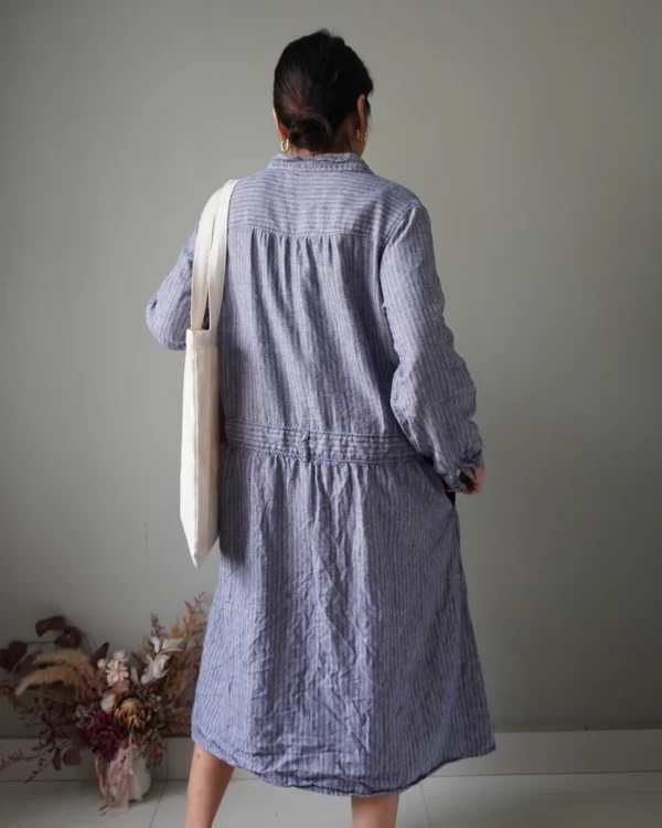 Blue striped pattern dress with button down details, cozy long sleeves and pleat accents - Image 4