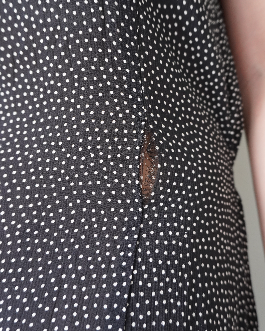 Black polka patterned dress with back zipper and ribbon that ties to the back, has few removed hems that’s reworkable - Image 4