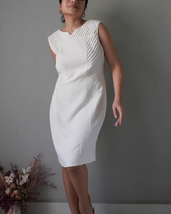 Elevated with pleat accents, edgy white sleeveless dress with zipper at the back - Image 1