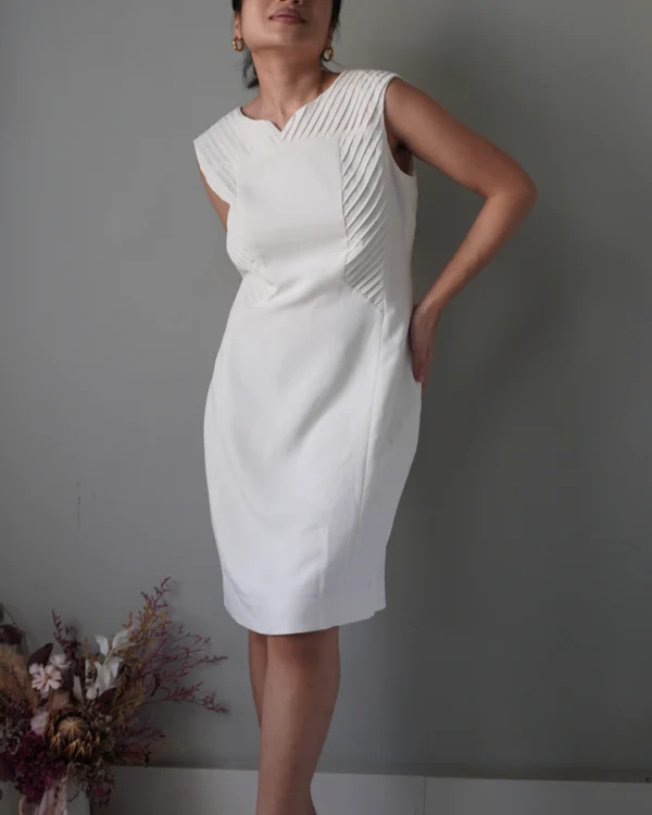 Elevated with pleat accents, edgy white sleeveless dress with zipper at the back - Image 2