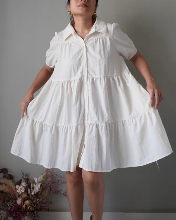 Cream babydoll button down dress with tiered details, shape-friendly - Image 1